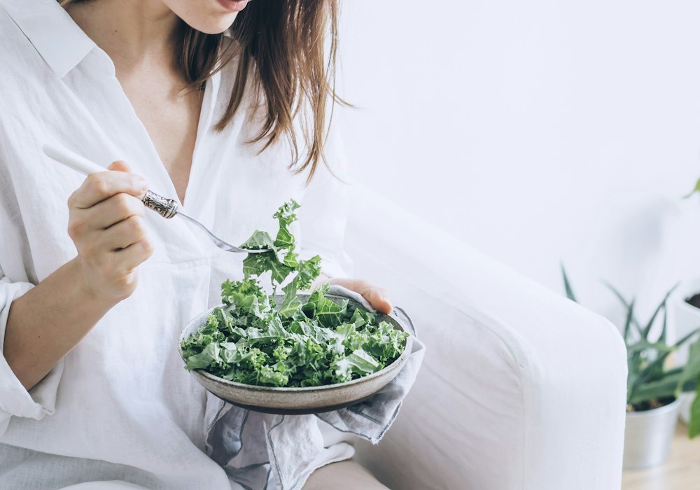 Woman enjoying a fresh green salad